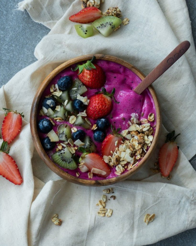 Dragon fruit smoothie bowl with fresh strawberries, blueberries, and kiwi — do I need supplements when whole food is this complete