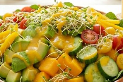 What happens when you eat raw food for 30 days — vibrant salad bowl with mango, avocado, cucumber, cherry tomatoes, and fresh sprouts