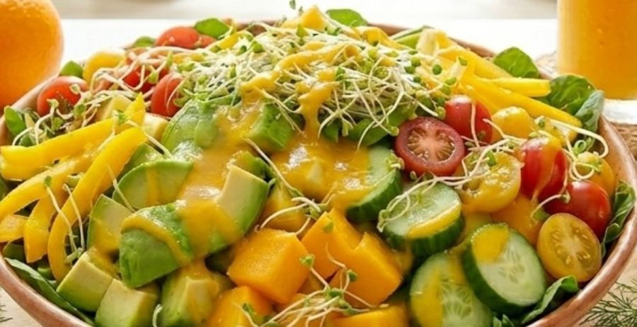 What happens when you eat raw food for 30 days — vibrant salad bowl with mango, avocado, cucumber, cherry tomatoes, and fresh sprouts