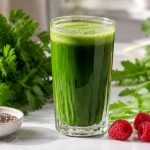 Fresh green juice with parsley, dandelion greens, chia seeds and raspberries — plant-powered eating after PCOS renamed PMOS