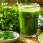Parsley juice benefits in a glass — fresh parsley, cucumber, green apples, and lime around the daily detox green juice