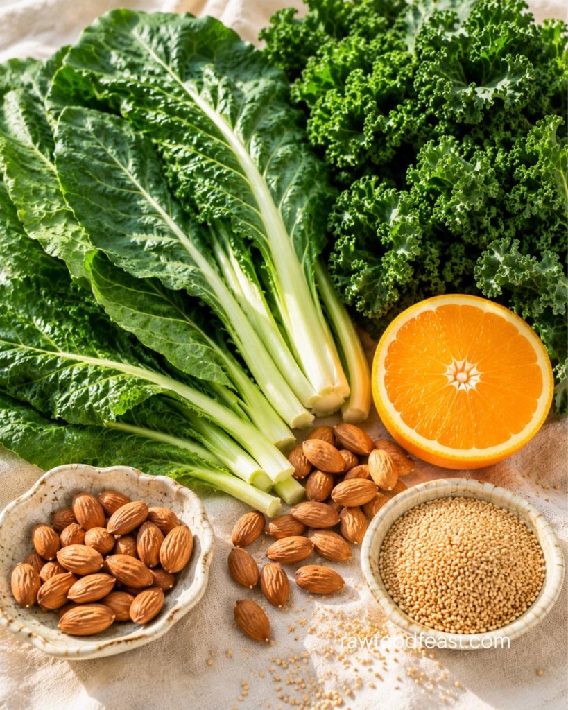 Plant calcium cofactors — fresh collards, kale, almonds, halved orange, and sesame seeds for absorption support